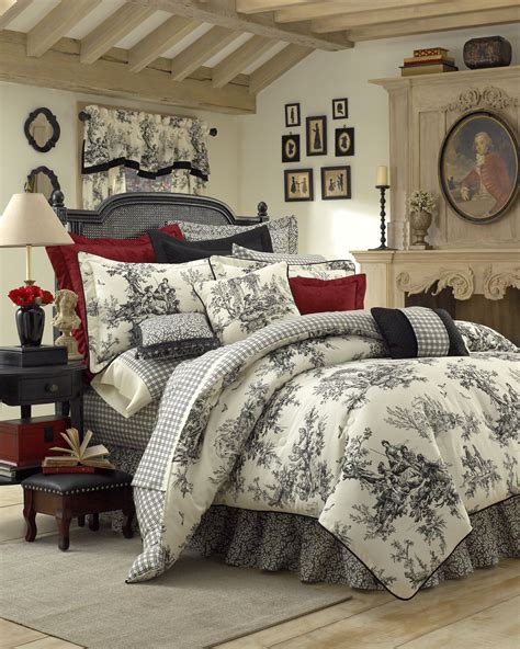 A crisp white embroidered pillow cover adds a romantic touch. . Toile bedding